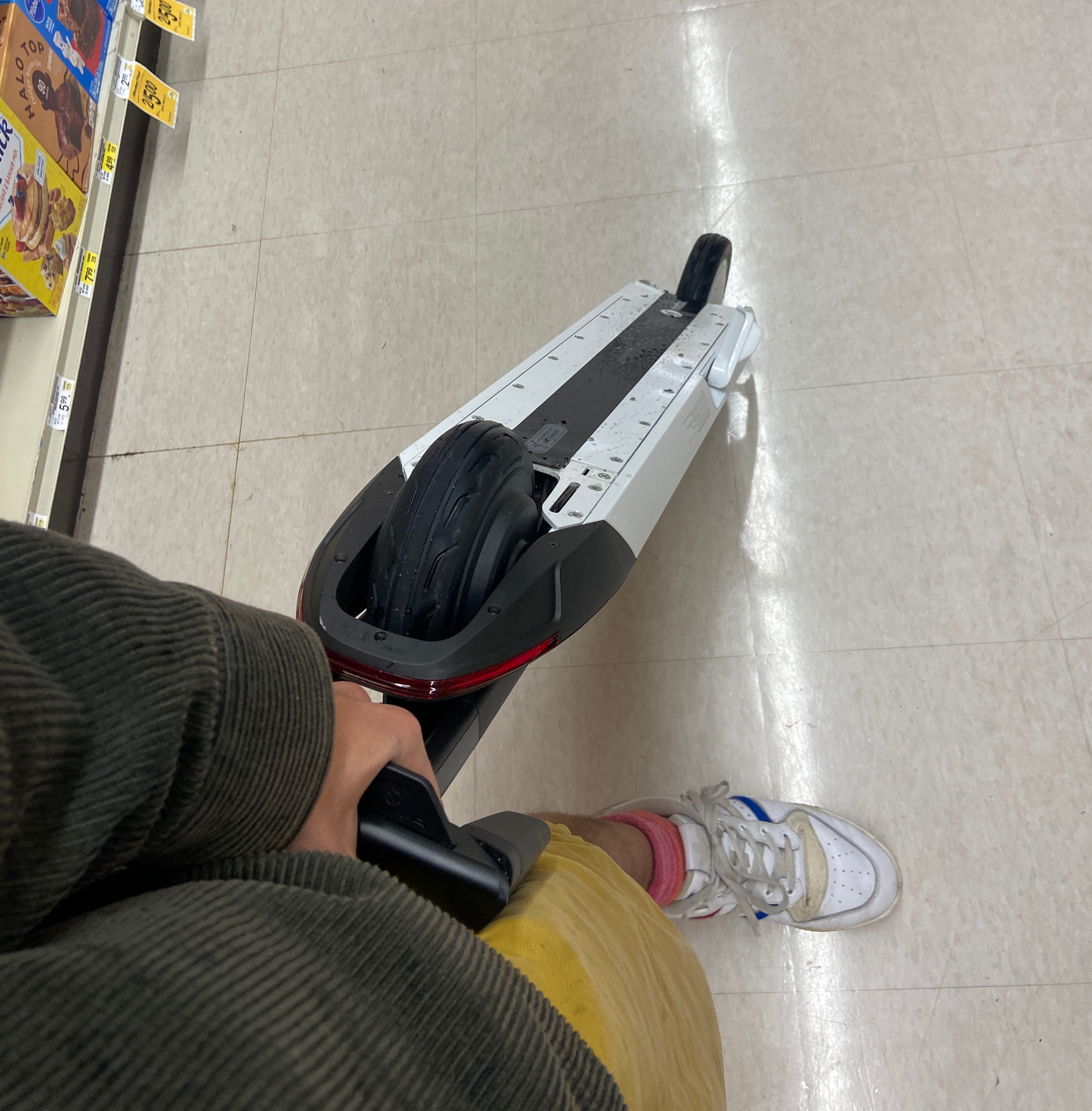 Folded electric scooter in grocery store