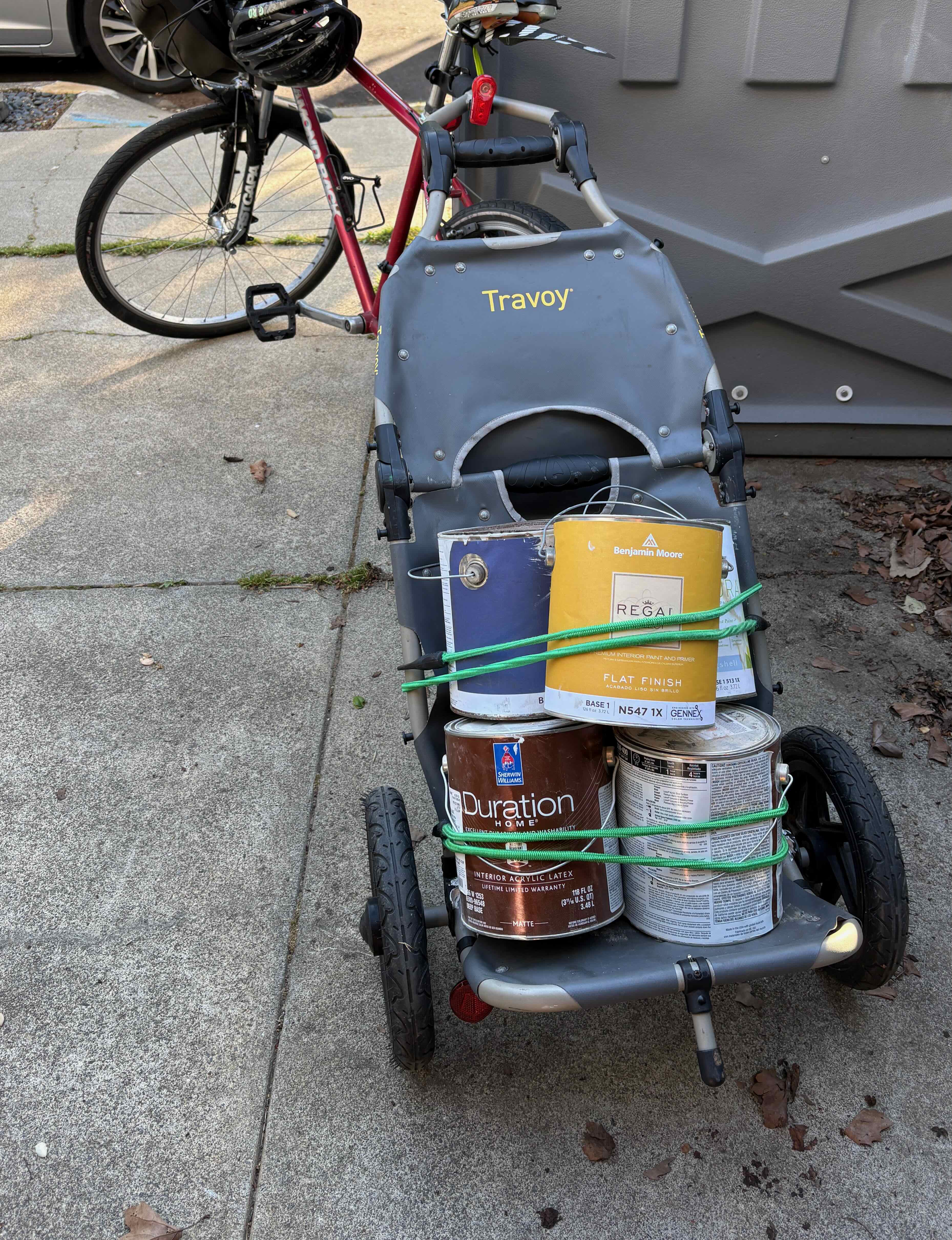 Travoy with Benjamin Moore and Sherwin-Williams cans bungeed to the frame
