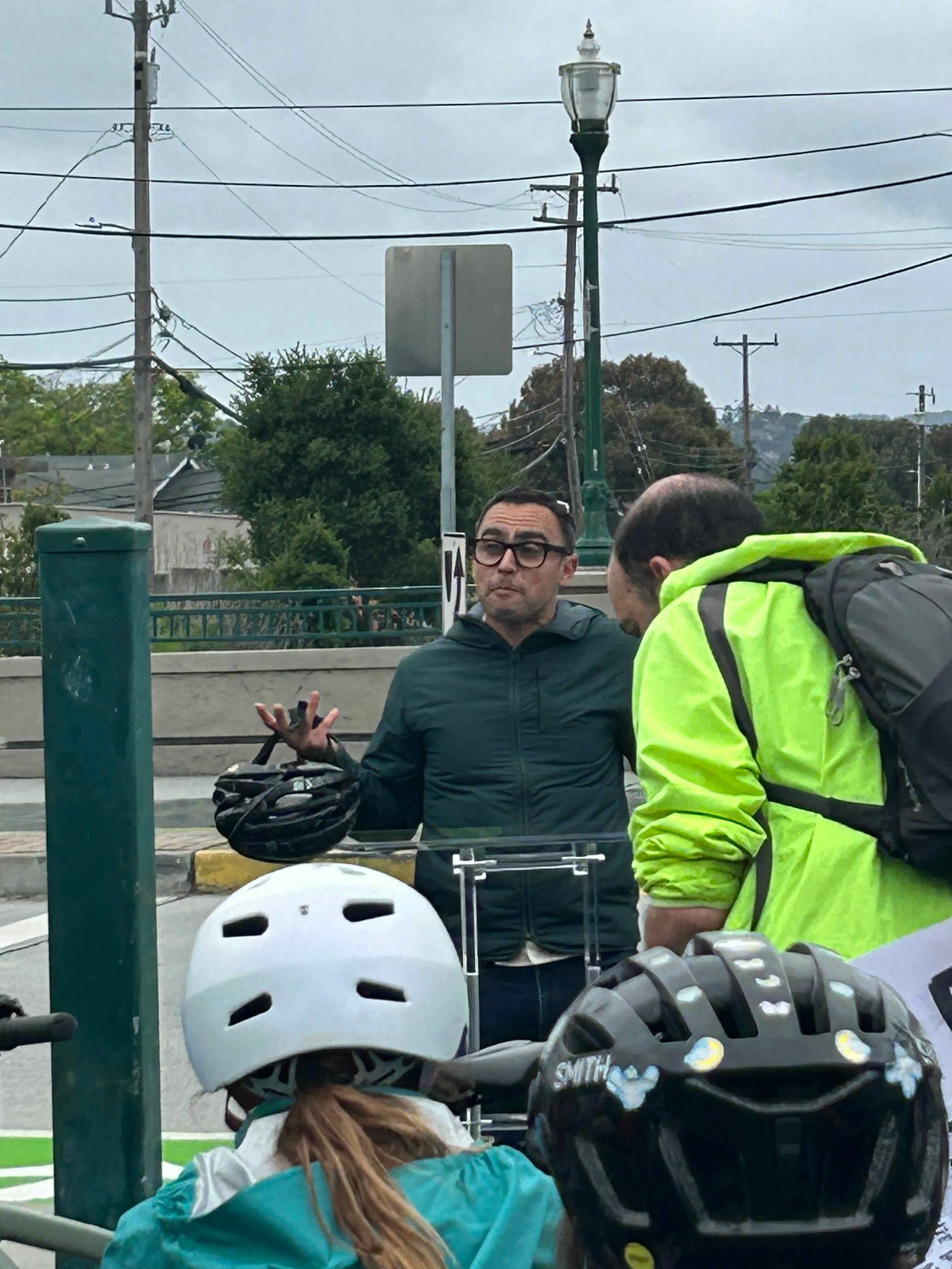 Red bike with Travoy carrying Safe Streets signage