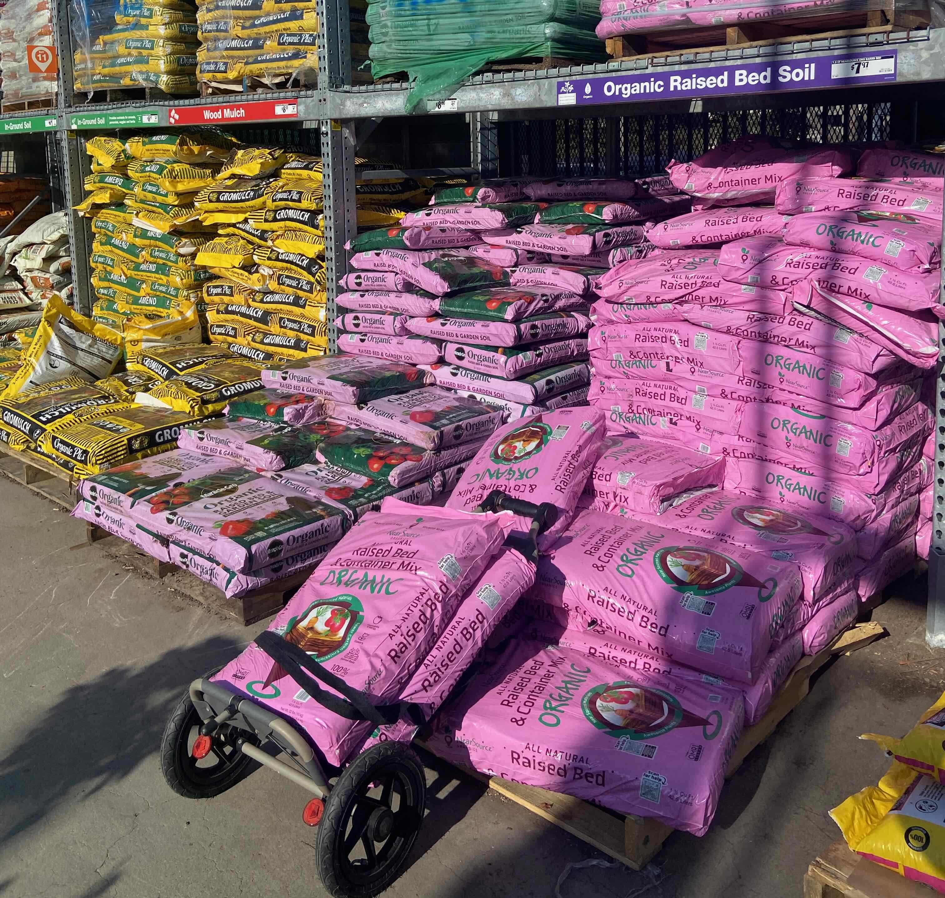 Travoy loaded with bags of soil at Home Depot