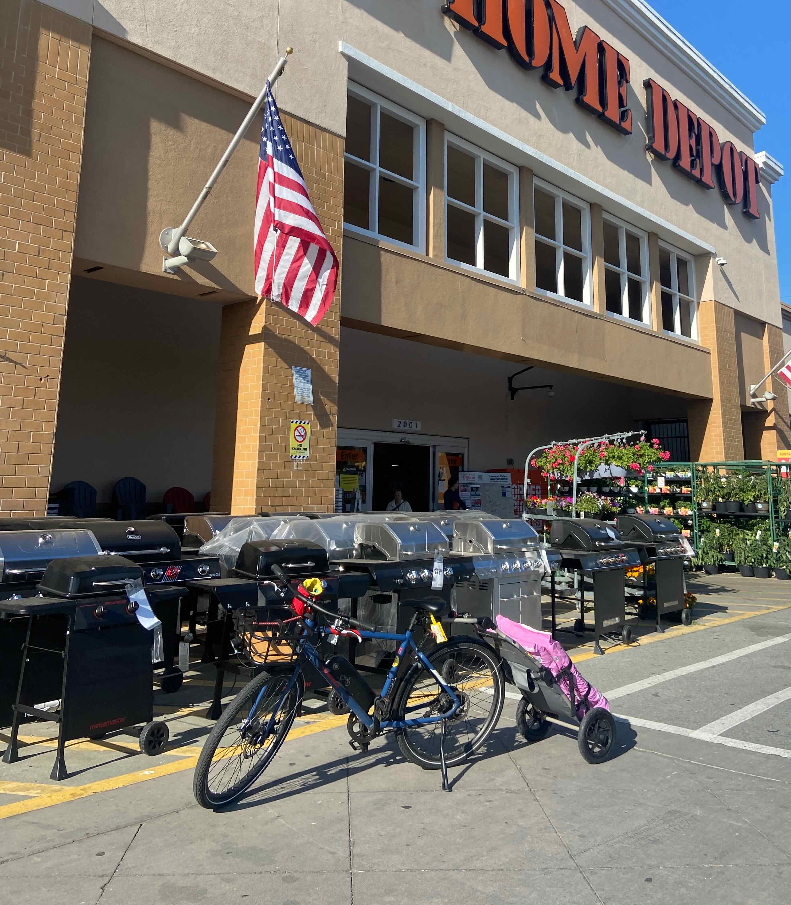 Travoy loaded with bags of soil at Home Depot