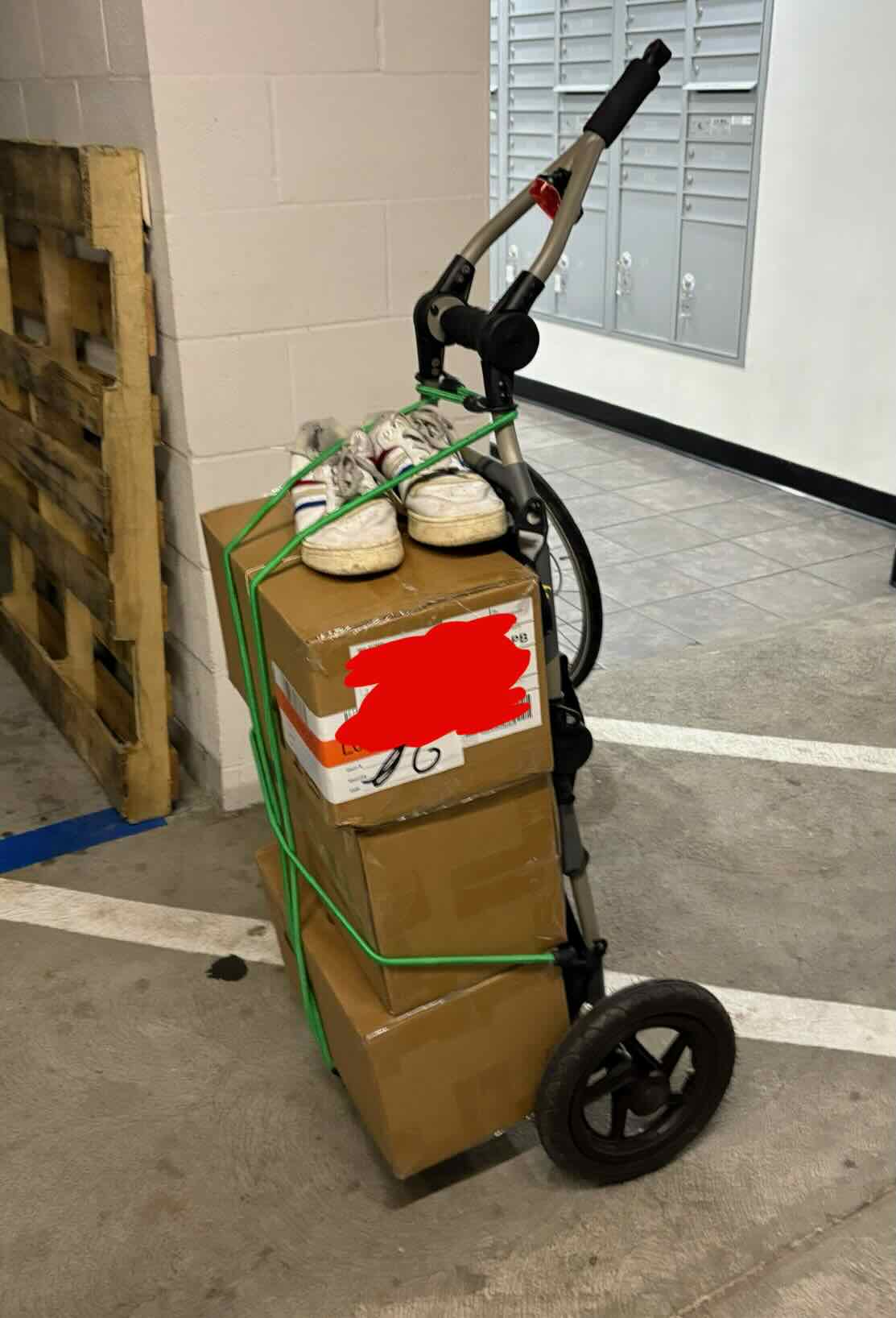 Travoy folded upright with boxes for transport