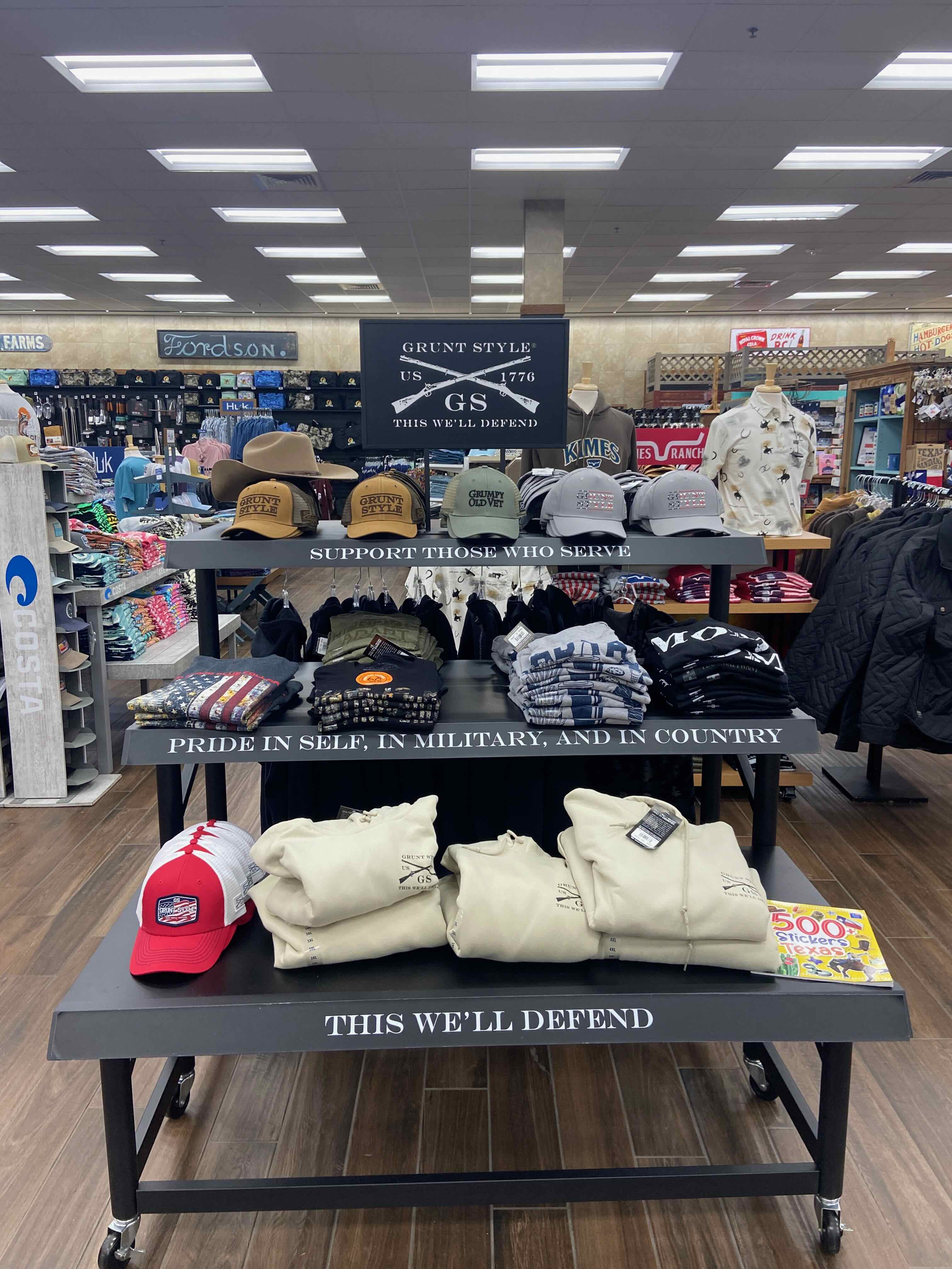 PHOTO: Grunt Style display — "Support Those Who Serve," "Pride in Self, in Military, and in Country," "This We'll Defend"