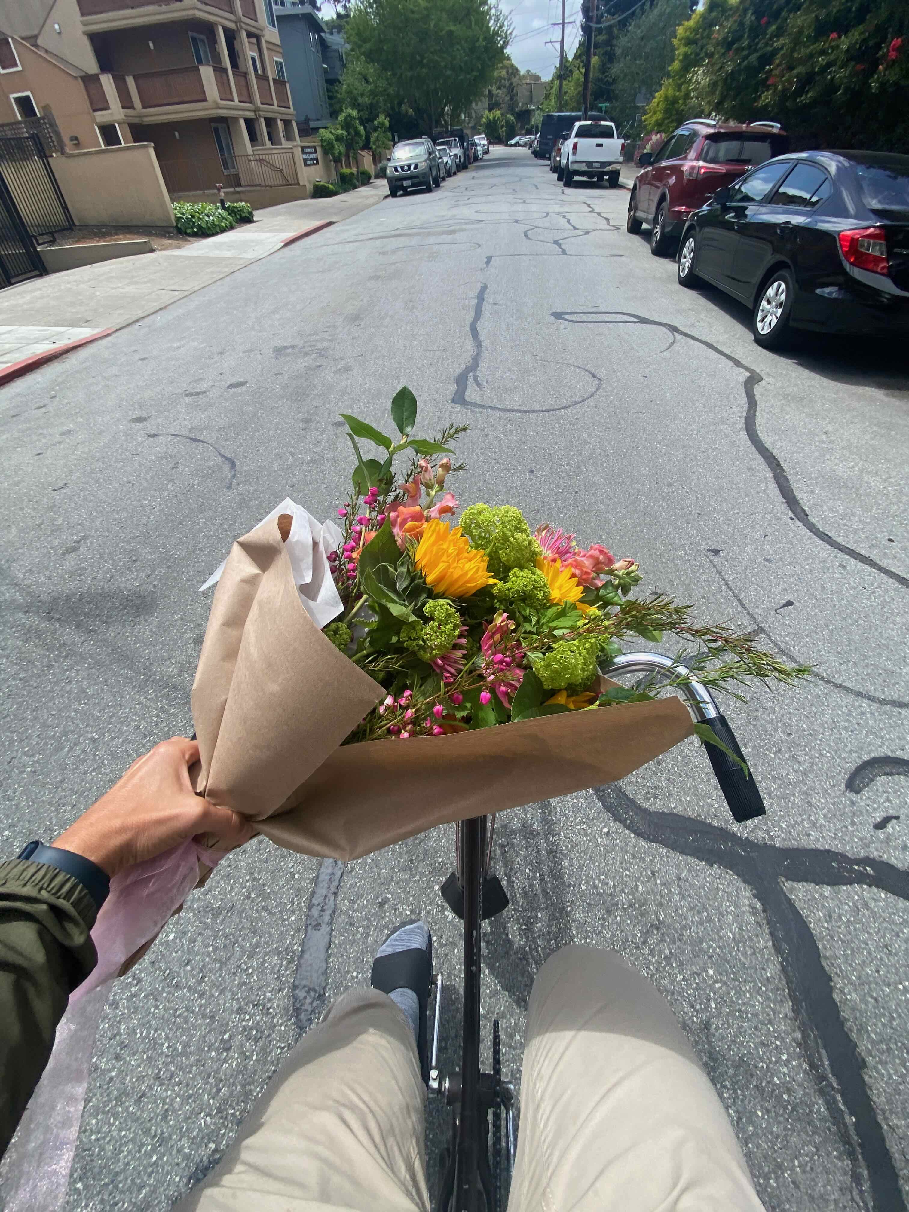 riding a bicycle with flowers