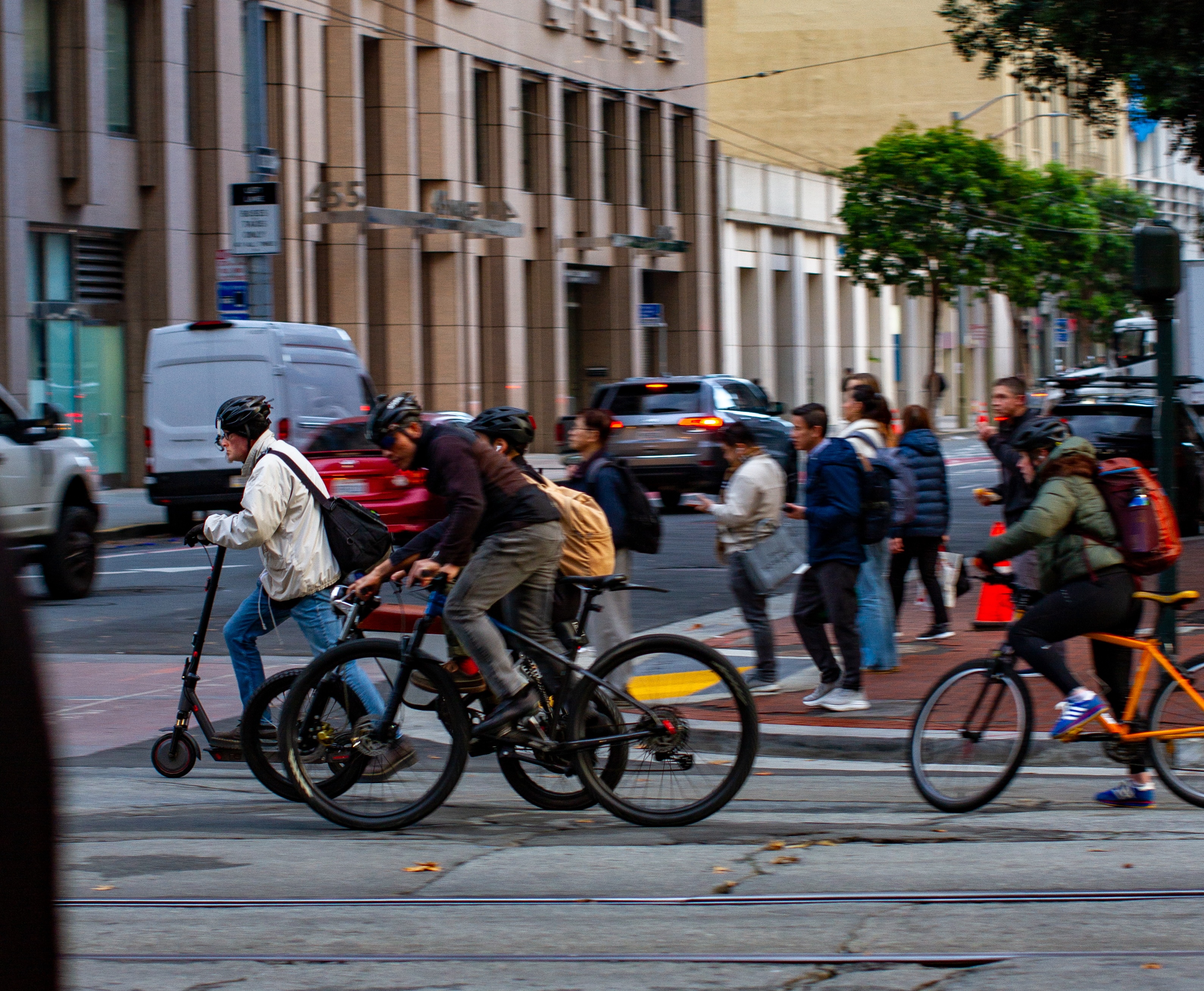 Urban street scene showing bike infrastructure and public transit on Market Street, San Francisco