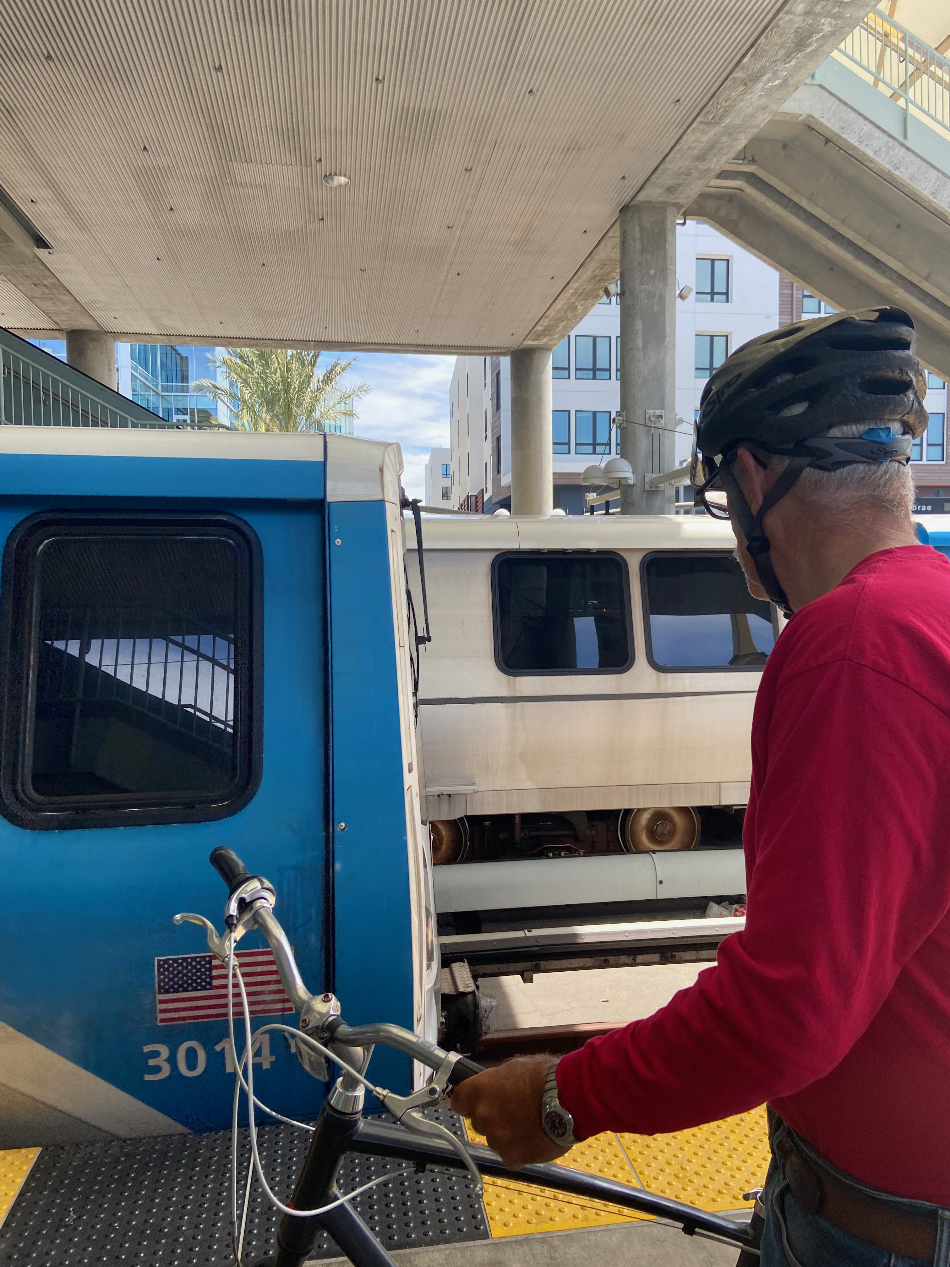 Mike with his bicycle inspecting the new BART cars as they arrive at Millbrae station
