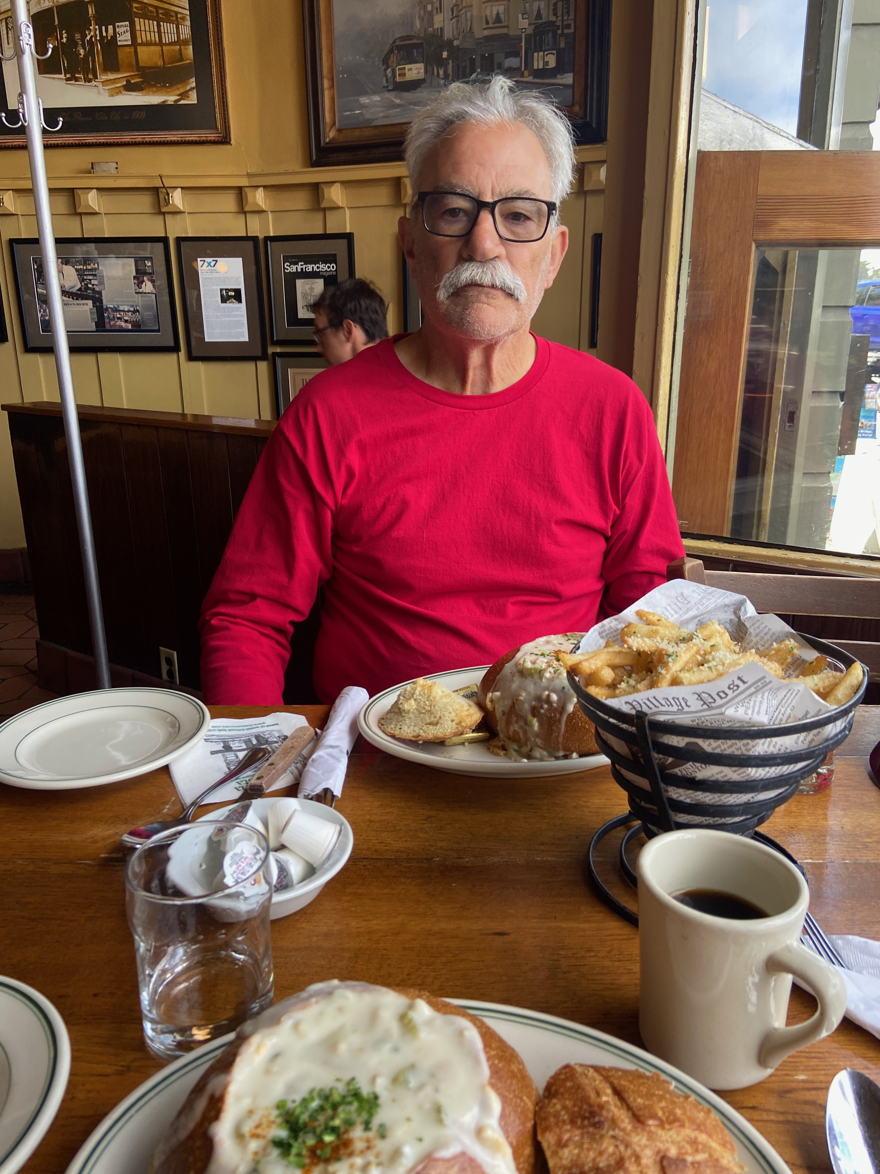 Mike eating clam chowder and garlic fries