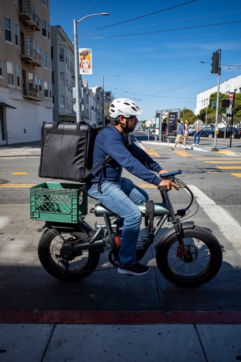 food delivery gig-worker on e-bike