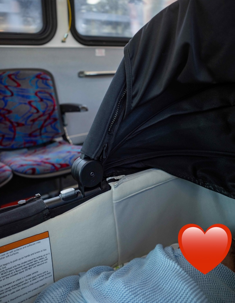 newborn in stroller on the bus