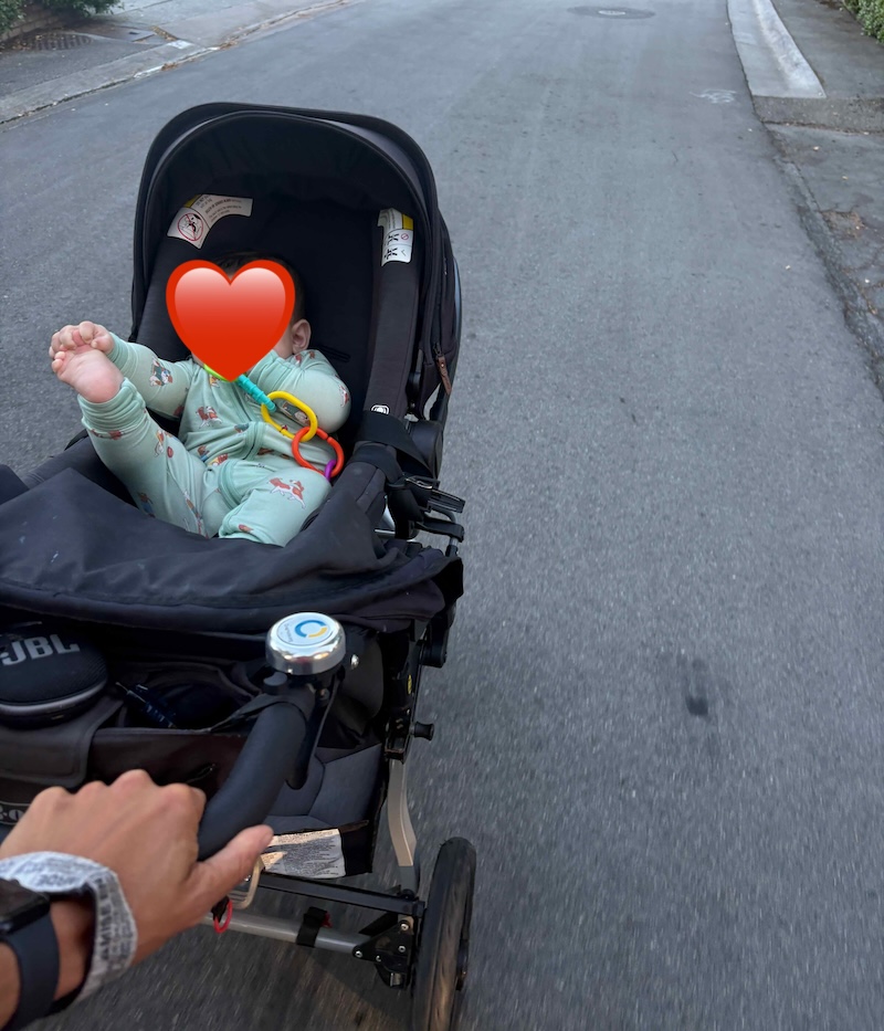 infant in a jogging stroller