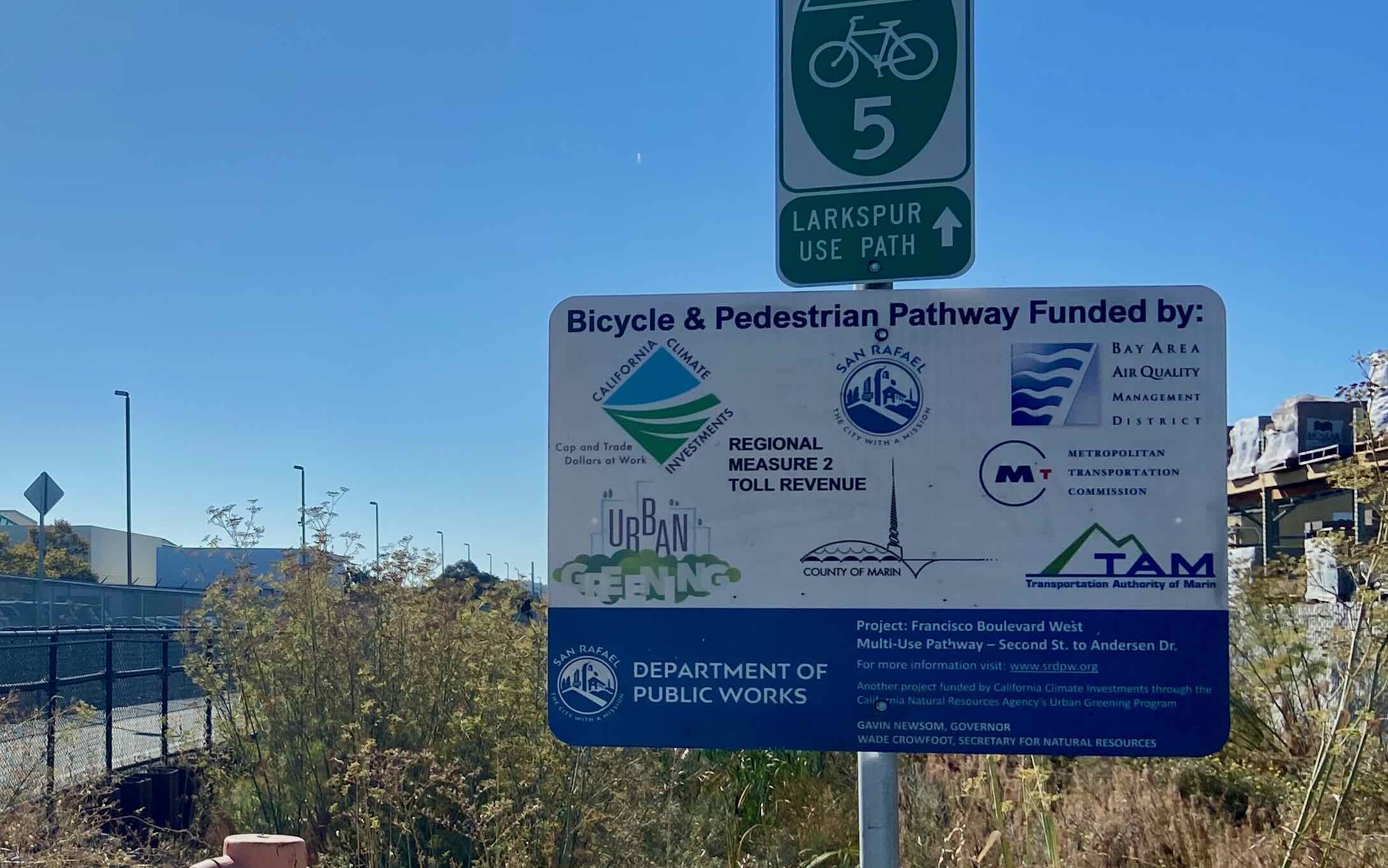 a project funding sign, illustrating 8 funding sources to build a bike path