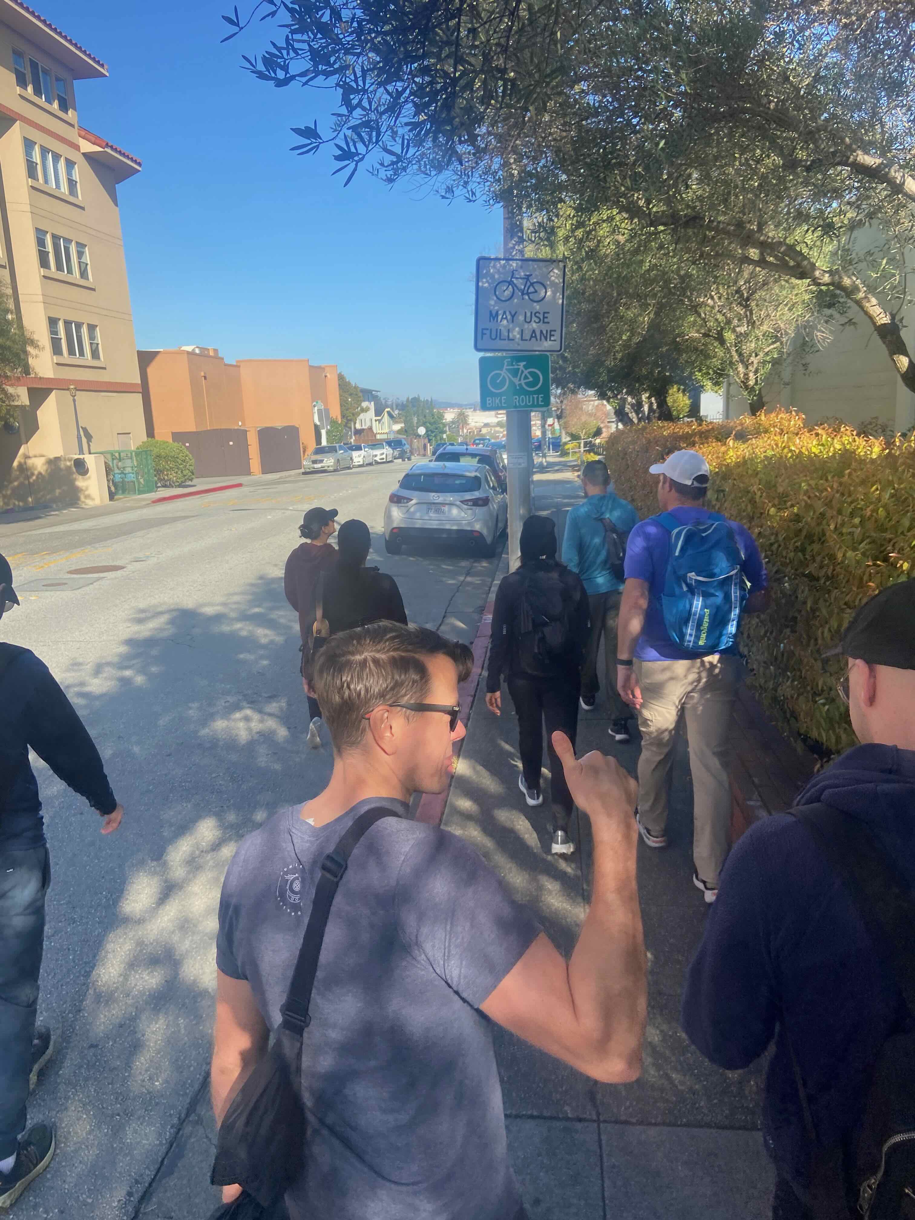 group walking northbound through Millbrae