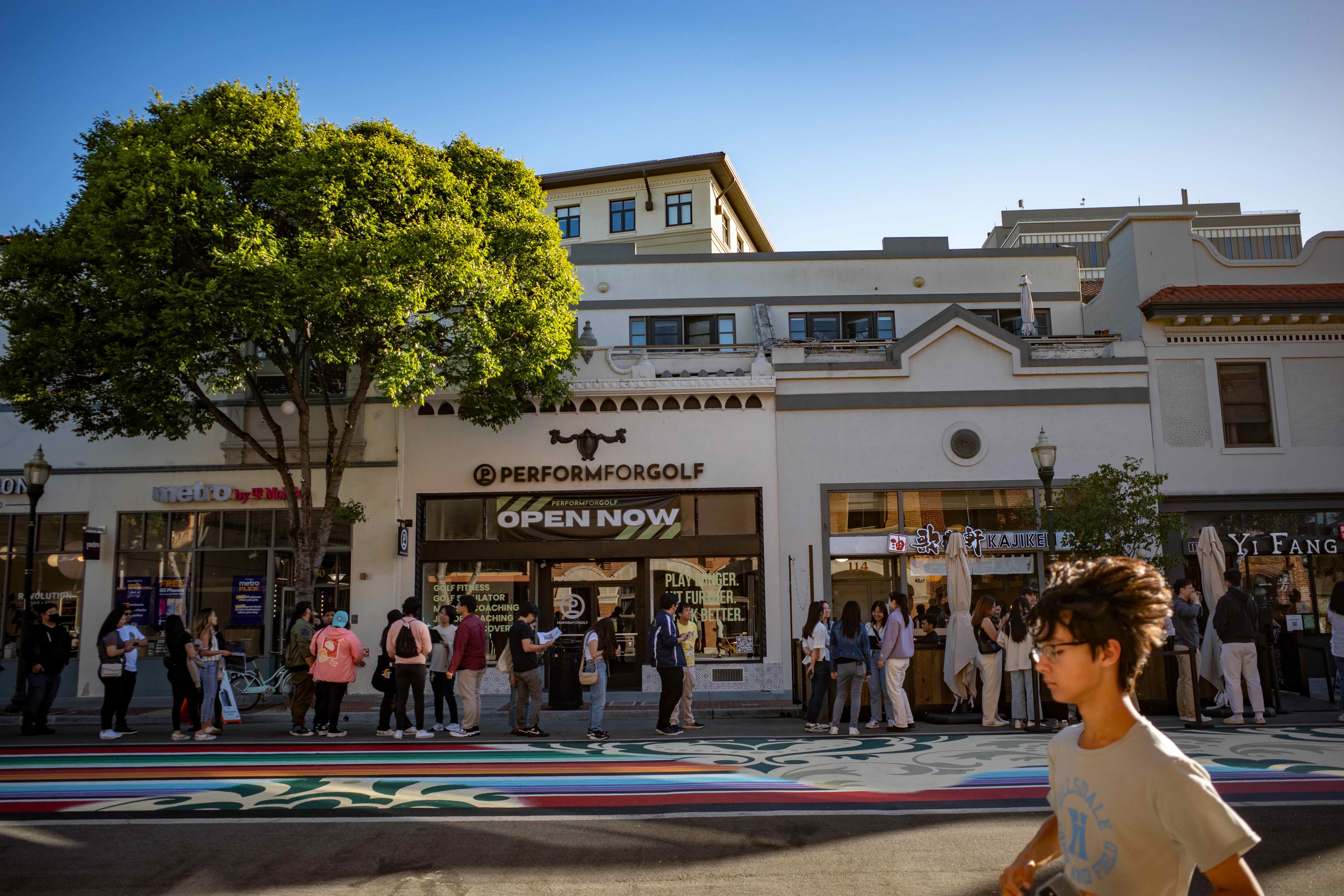 A long line of customers waiting outside Kajiken ramen on pedestrianized B Street