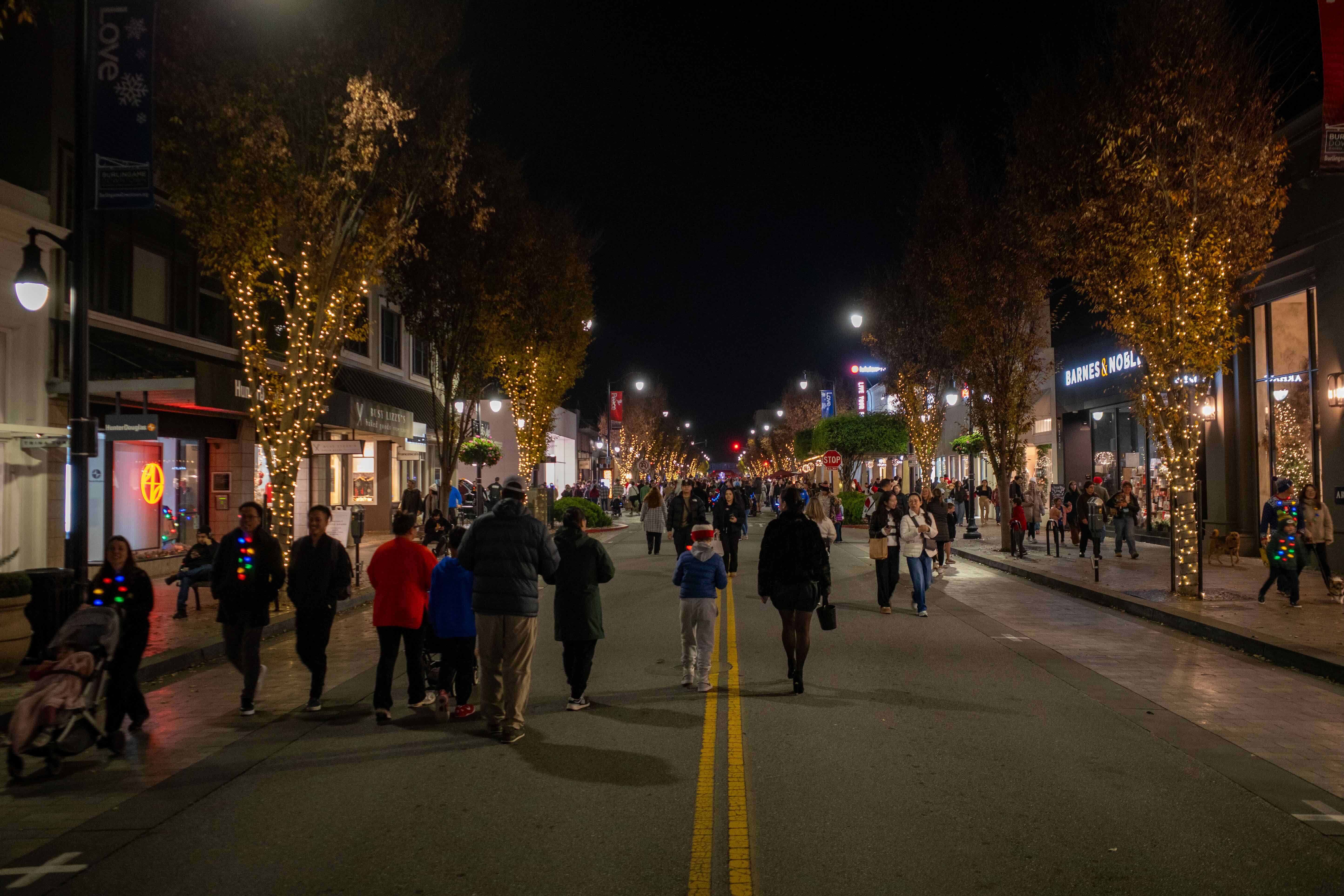People walking on Burlingame Avenue during a holiday street closure