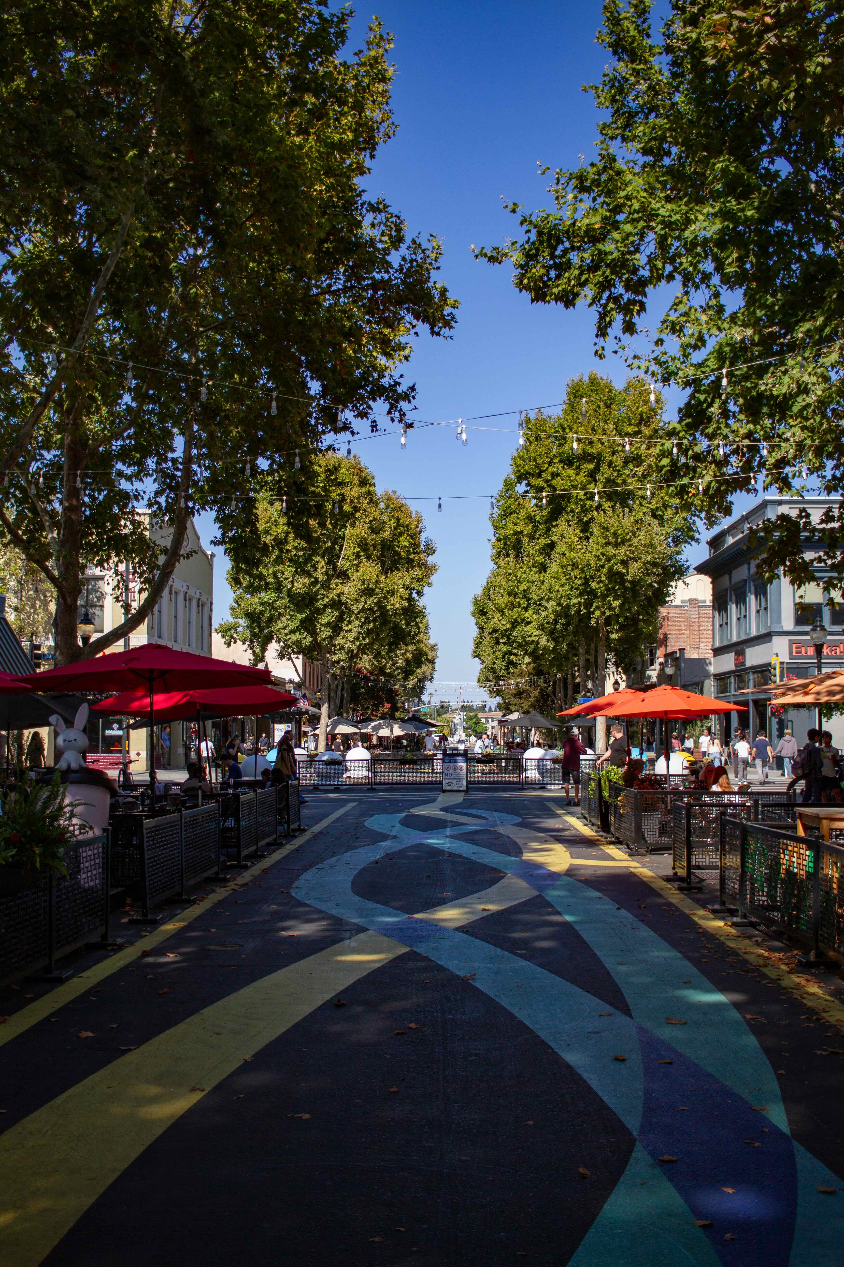Castro Street in Mountain View, California with a painted mural between parklets